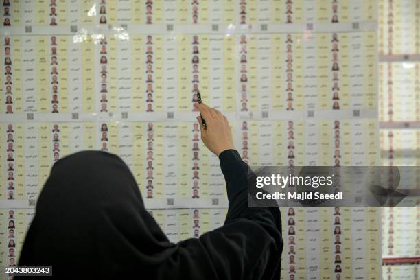Iranian people arrive to cast their votes for 12th term of the parliamentary elections and the 6th term of the Assembly of Leadership Experts at a...