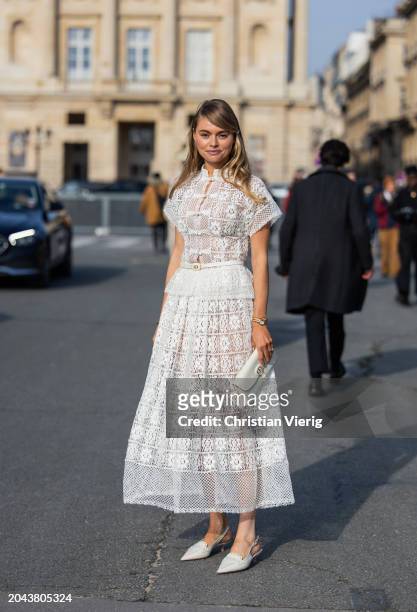 Claire Rose Cliteur wears white laced skirt, top, bag, heels outside Dior during the Womenswear Fall/Winter 2024/2025 as part of Paris Fashion Week...