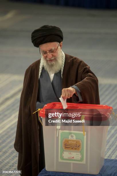 Iran's supreme leader Ayatollah Ali Khamenei casts his ballots during the parliamentary and key clerical body elections at a polling station on March...