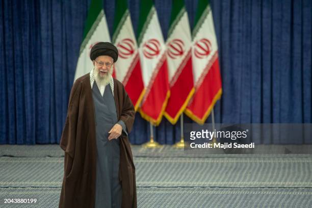 Iran's supreme leader Ayatollah Ali Khamenei arrives to cast his ballots during the parliamentary and key clerical body elections at a polling...