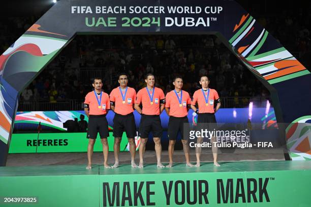 Referees pose during the award ceremony following the FIFA Beach Soccer World Cup UAE 2024 Final match between Brazil and Italy at Dubai Design...