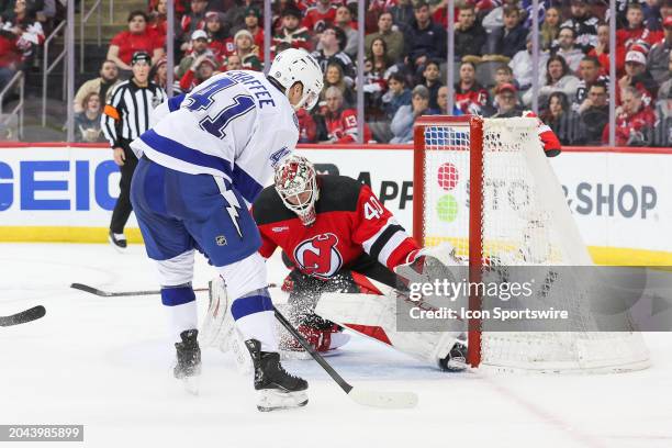 Tampa Bay Lightning right wing Mitchell Chaffee is stopped by New Jersey Devils goaltender Akira Schmid during a game between the against the against...