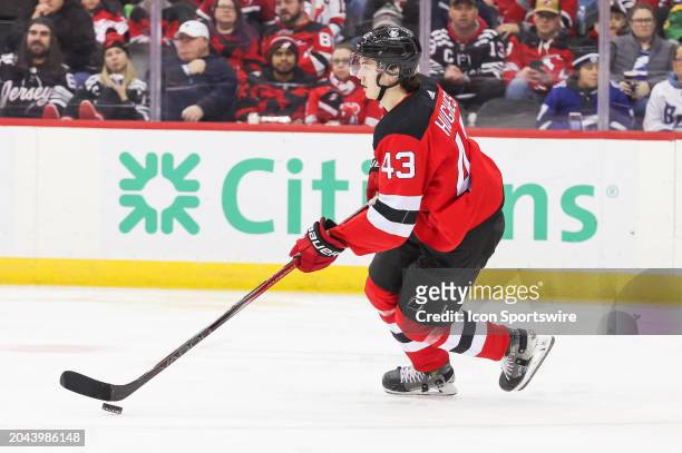 New Jersey Devils defenseman Luke Hughes skates with the puck during a game between the against the against the Tampa Bay Lightning and New Jersey...