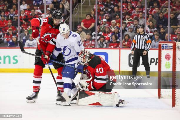 New Jersey Devils goaltender Akira Schmid makes a save through traffic during a game between the against the against the Tampa Bay Lightning and New...