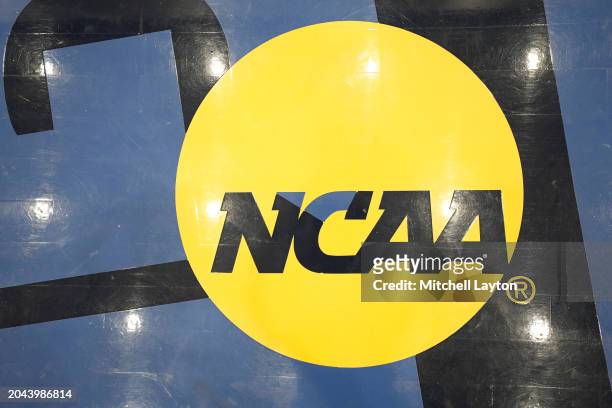 The NCAA logo shown on the floor before during a college basketball game between the Massachusetts Minutemen and the George Washington...