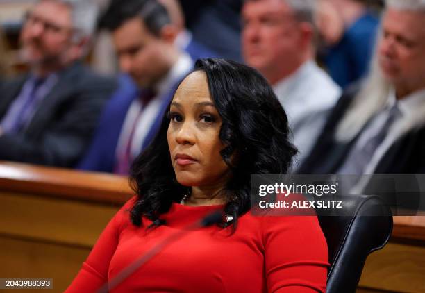 Fulton County District Attorney Fani Willis listens during the final arguments in her disqualification hearing at the Fulton County Courthouse on...