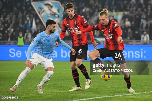 Milan's Danish defender Simon Kjaer fights for the ball with Lazio's Argentine midfielder Valentin Castellanos during the Italian Serie A football...