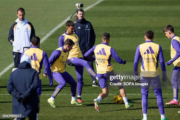 Daniel Ceballos of Real Madrid CF competes for the ball with Lucas Vazquez and Francisco Garcia, known as Fran Garcia during the training session...