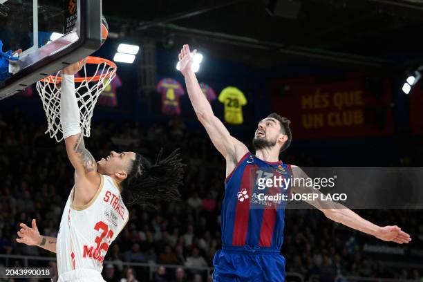 Monaco's French centre Matthew Strazel puts up the ball to the basket against Barcelona's Czech guard Tomas Satoransky during the Euroleague...