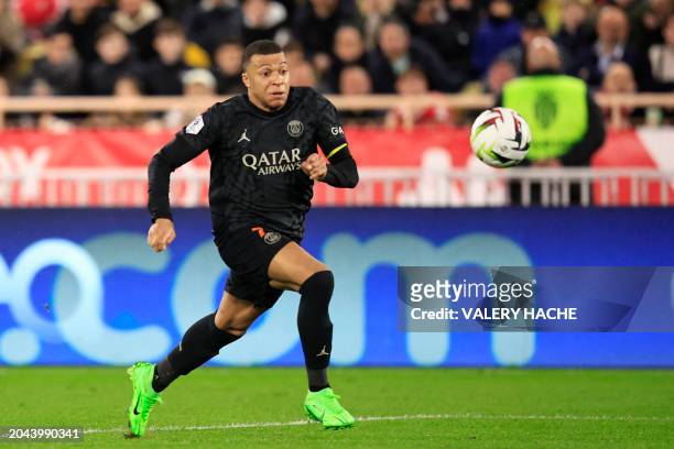 Paris Saint-Germain's French forward Kylian Mbappe controls the ball during the French L1 football match between AS Monaco and Paris Saint-Germain at...