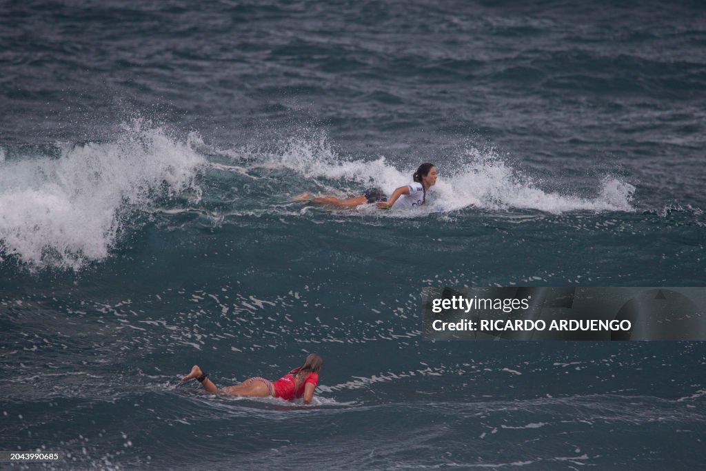 Japan's Amuro Tsuzuki and Germany's Camila Kemp look for waves during
