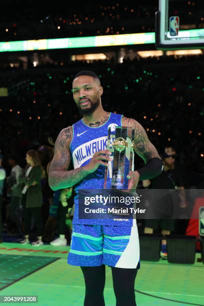 Damian Lillard of the Milwaukee Bucks poses for a photo after winnings the Starry 3 Point Contest as a part of State Farm All-Star Saturday Night on...