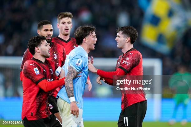 Luca Pellegrini of SS Lazio argues with Christian Pulisic of AC Milan after he received a red card during the Serie A TIM match between SS Lazio and...