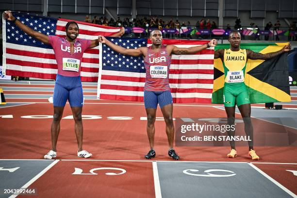 Second-placed USA's Noah Lyles, first-placed USA's Christian Coleman third-placed Jamaica's Ackeem Blake competes in the Men's 60m final during the...