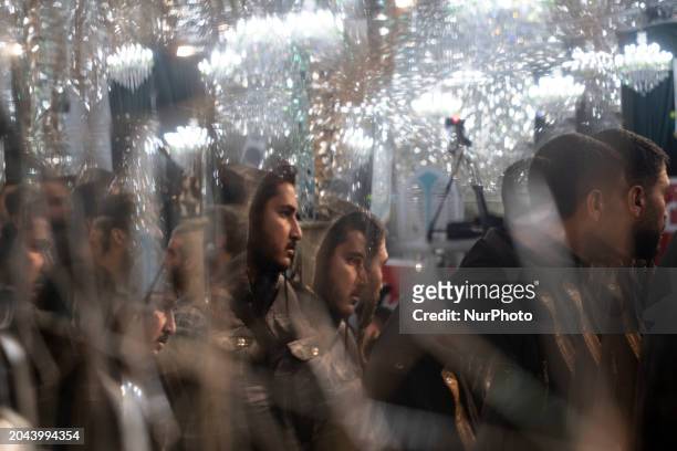 Voters are standing in line while waiting to cast their ballots at a polling station in southern Tehran, Iran, on March 1 during the Parliamentary...