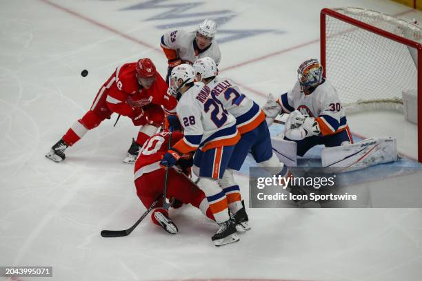 New York Islanders goalie Ilya Sorokin guards the goal during a scrum in front of the net during an NHL regular season hockey game between the New...
