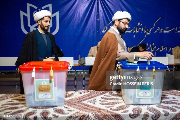 Iranians participate in the 12th term parliamentary elections and the 6th term Assembly of Leadership Experts' voting at a Tehran polling station on...