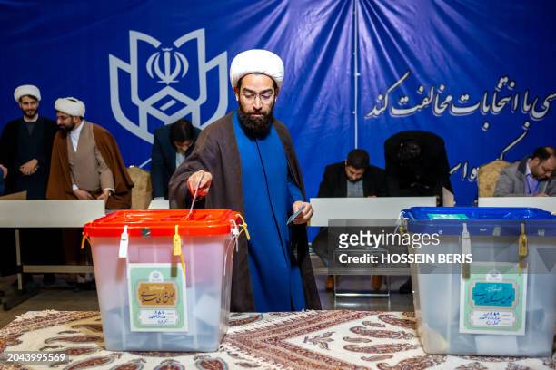 Iranians participate in the 12th term parliamentary elections and the 6th term Assembly of Leadership Experts' voting at a Tehran polling station on...