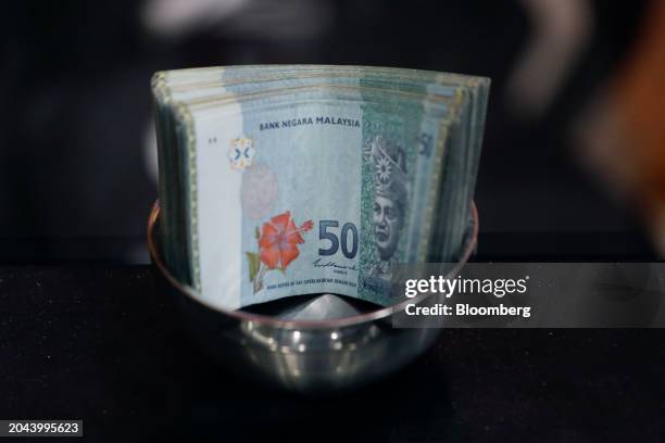 Malaysian fifty ringgit banknotes at a currency exchange store in Kuala Lumpur, Malaysia, on Friday, March. 1, 2024. Policymakers have stepped up...