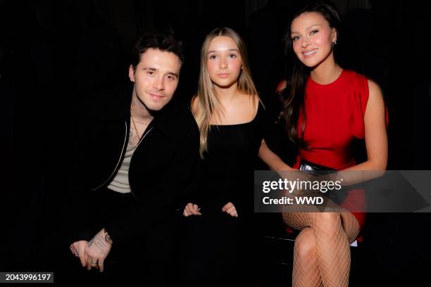 Brooklyn Beckham, Harper Beckham, and Nicola Peltz Beckham at Victoria Beckham RTW Fall 2024 as part of Paris Ready to Wear Fashion Week held at...