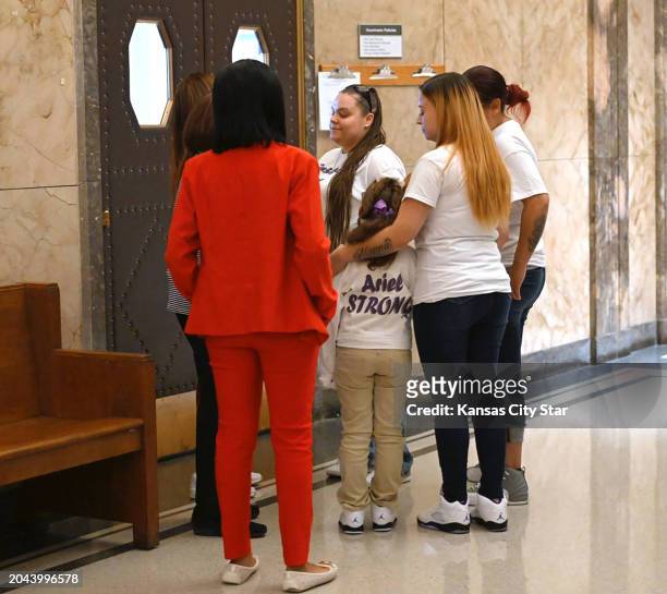 Felicia Moore, right, put her arm around her daughter, Ariel Young while they waited outside a Jackson County, Missouri, courtroom ON Tuesday, Nov. 1...