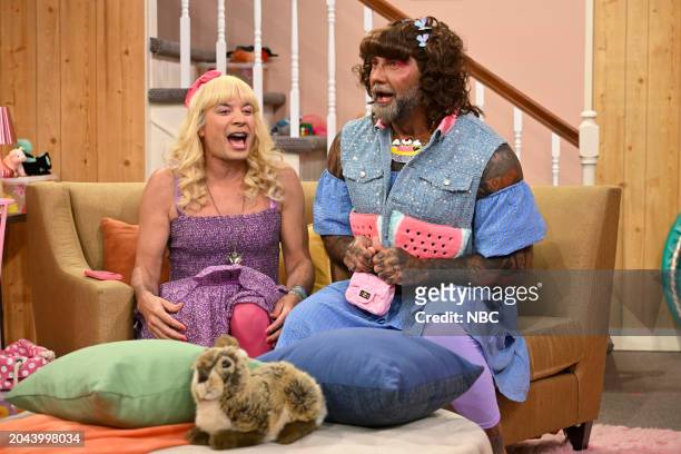 Episode 1931 -- Pictured: Host Jimmy Fallon and actor Dave Bautista during "Ew!" on Friday, March 1, 2024 --