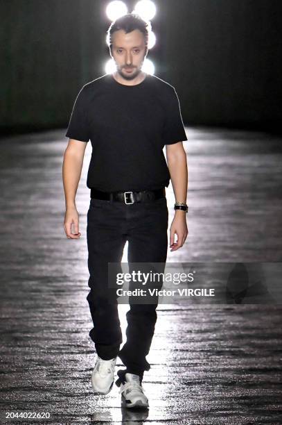 Fashion designer Anthony Vaccarello walks the runway during the Saint Laurent Ready to Wear Fall/Winter 2024-2025 fashion show as part of the Paris...