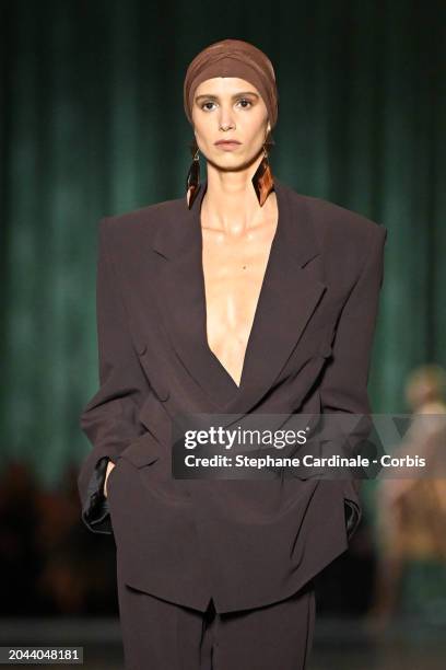 Mica Arganaraz walks the runway during the Saint Laurent Womenswear Fall/Winter 2024-2025 show as part of Paris Fashion Week on February 27, 2024 in...