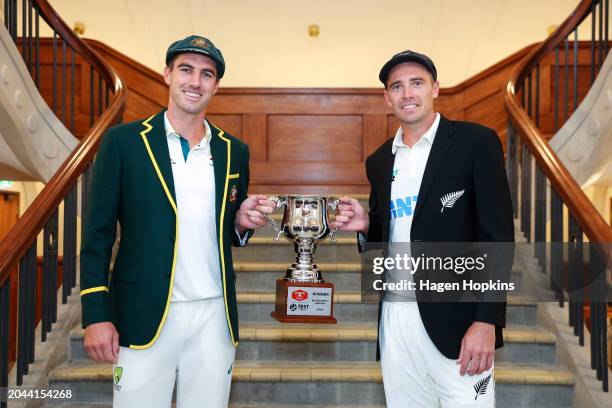 Pat Cummins of Australia and Tim Southee of New Zealand pose with the test series trophy during a nets session ahead of the First Test in the series...