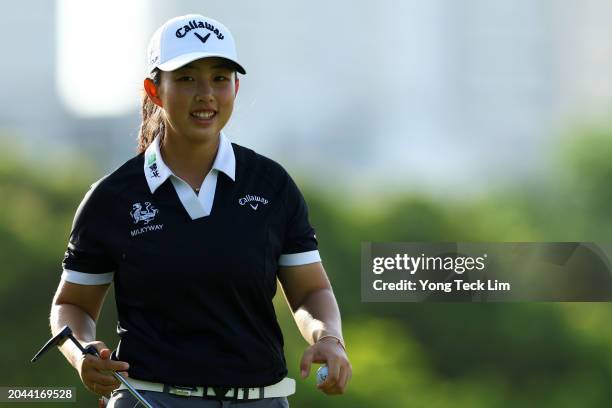 Ruoning Yin of China reacts after sinking her putt on the 13th green during a pro-am tournament prior to the HSBC Women's World Championship at...
