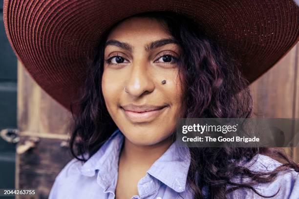 portrait of smiling woman wearing hat - blue blouse stock pictures, royalty-free photos & images