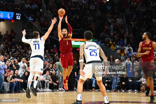 Max Strus of the Cleveland Cavaliers shoots a half-court shot over Luka Doncic of the Dallas Mavericks to defeat the Mavericks in the last second of...