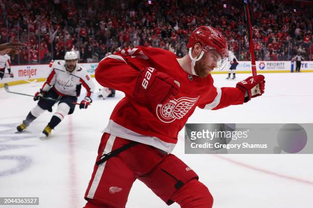 Compher of the Detroit Red Wings celebrates his second period goal in front of Alex Ovechkin of the Washington Capitals at Little Caesars Arena on...