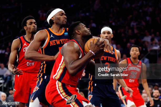 Zion Williamson of the New Orleans Pelicans goes to the basket as Precious Achiuwa and Josh Hart of the New York Knicks defend during the second half...