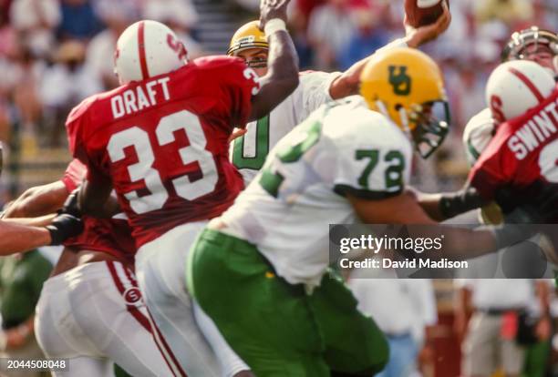 Tony Graziani of the Oregon Ducks attempts a pass during an NCAA Pac-10 college football game against the Stanford Cardinal on October 27, 1997 at...