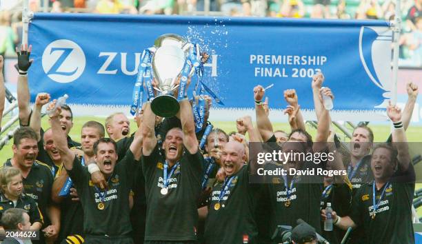 Lawrence Dallaglio, captain of Wasps raises the trophy after winning the Zurich Premiership Final between Gloucester and London Wasps at Twickenham...