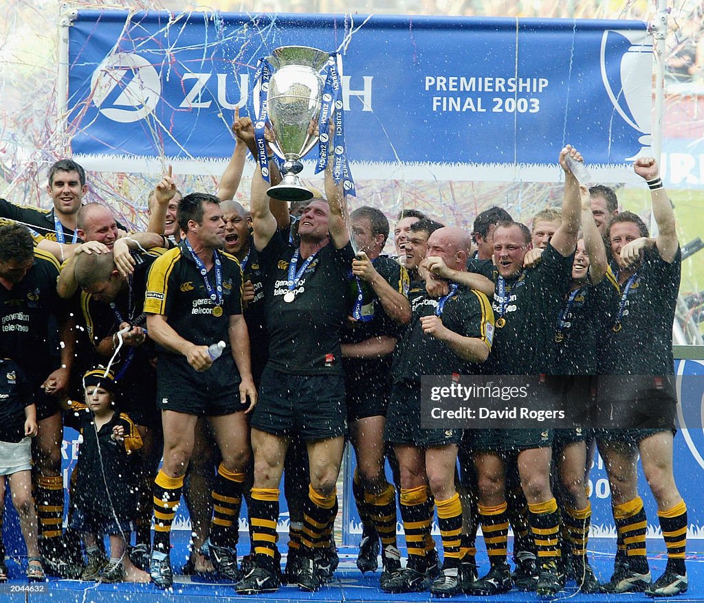 Lawrence Dallaglio, captain of Wasps raises the trophy