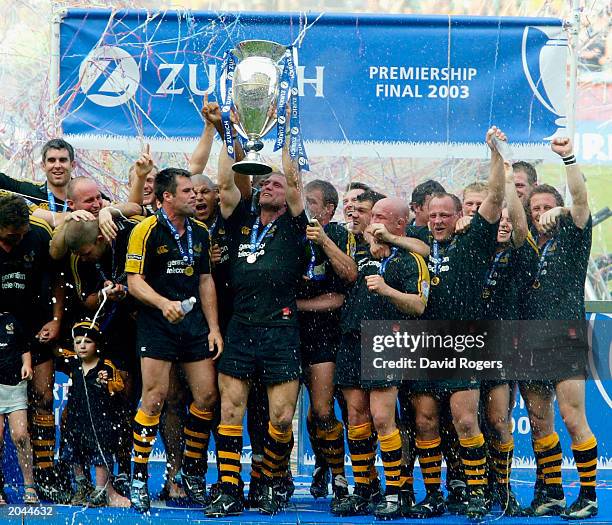 Lawrence Dallaglio, captain of Wasps raises the trophy after winning the Zurich Premiership Final between Gloucester and London Wasps at Twickenham...