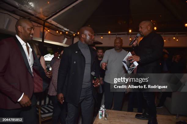 Metta Sandiford-Artest, Akbar Gbajabiamila and Daymond John attend Daymond John's Rise Nation Mastermind Welcome Party at Harriet's Rooftop on...