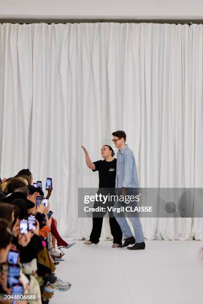 Fashion designers Ester Manas and Balthazar Delepierre walk the runway during the Ester Manas Ready to Wear Fall/Winter 2024-2025 fashion show as...