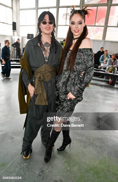 Jackariaeh Francis and Coco Rocha attend the Andreas Kronthaler for Vivienne Westwood Womenswear Fall/Winter 2024-2025 show as part of Paris Fashion...