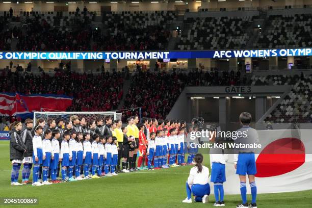 Players and match officials line up prior to the Women's Football Paris Olympic Asian Final Qualifier second leg between Japan and North Korea at...