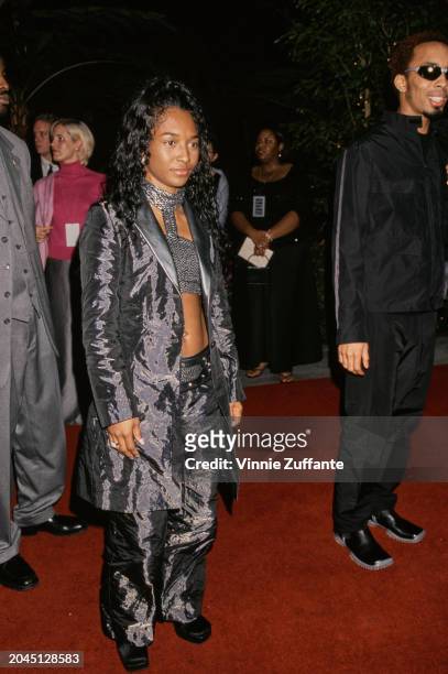 American singer Rozonda 'Chilli' Thomas, wearing a grey trouser suit over a grey cropped top, attends Arista Records Pre-Grammys Party ahead of the...