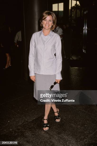 American actress and singer-songwriter Mare Winningham, wearing a light grey shirt with a dark grey skirt, attends the TNT Original Movie screening...