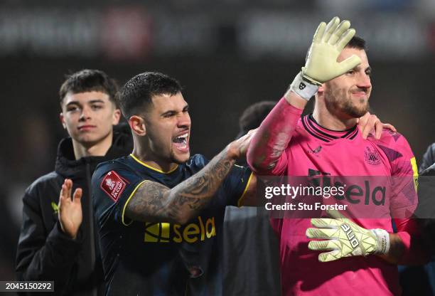 Newcastle player Bruno Guimaraes congratulates goalkeeper Martin Dubravka after he saved two penalties in the shoot out to give United victory during...