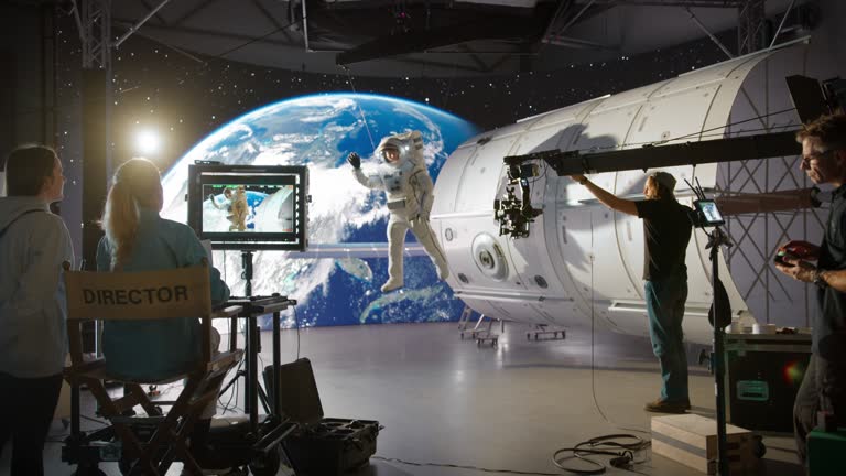 https://media.gettyimages.com/id/2045165648/video/creative-agency-filming-a-video-commercial-with-an-actor-wearing-an-astronaut-costume-and-is.jpg?b=1&s=640x640&k=20&c=9NsaHPKK7rliENMmKeZiq4YbLZKPTpndByBBHNWHXB0=