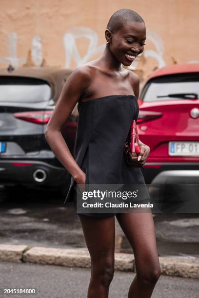 Amina Seck wears a black playsuit, outside Gucci, during the Milan Fashion Week - Womenswear Fall/Winter 2024-2025 on February 23, 2024 in Milan,...