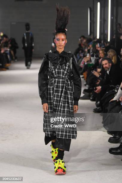 Model on the runway at Noir Kei Ninomiya RTW Fall 2024 as part of Paris Ready to Wear Fashion Week held on March 2, 2024 in Paris, France.