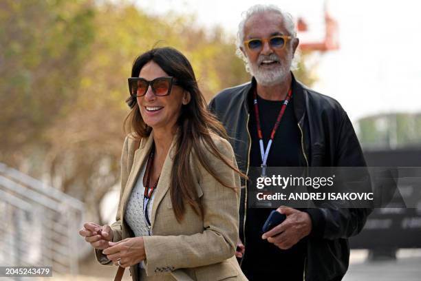 Italian businessman Flavio Briatore and Silvia Domenicali, wife of F1 CEO Stefano Domenicali, arrive ahead of the Bahrain Formula One Grand Prix at...