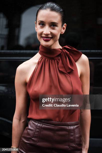 Maria Pedraza wears burnt orange top, brown leather midi skirt, outside Philosophy, during the Milan Fashion Week - Womenswear Fall/Winter 2024-2025...